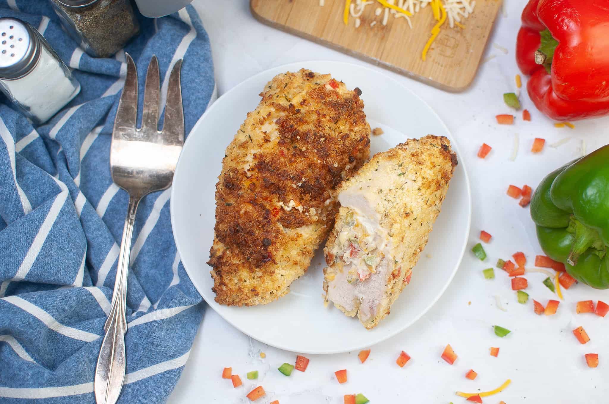 Crispy air fryer stuffed chicken breasts on a plate. 